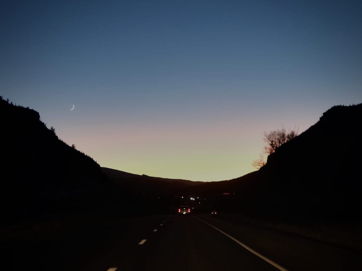 A Fingernail Moon Rose Over the Rockies